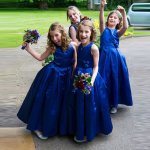 A-Line Round Neck Tea-Length Royal Blue Pleated Satin Flower Girl Dress with Flowers